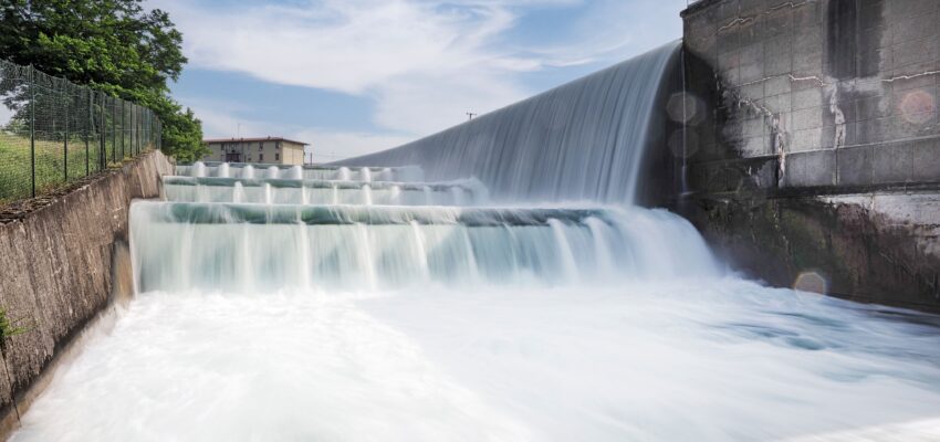 hydroelectic dam with stepped water spillway and cascading flow